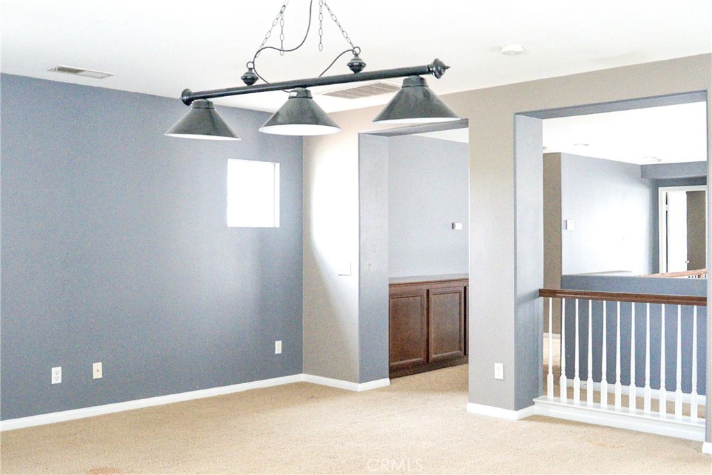 1373 Aztec Court Beaumont, CA 92223 - Photo 21 of 56 a view of a livingroom with a ceiling fan and window