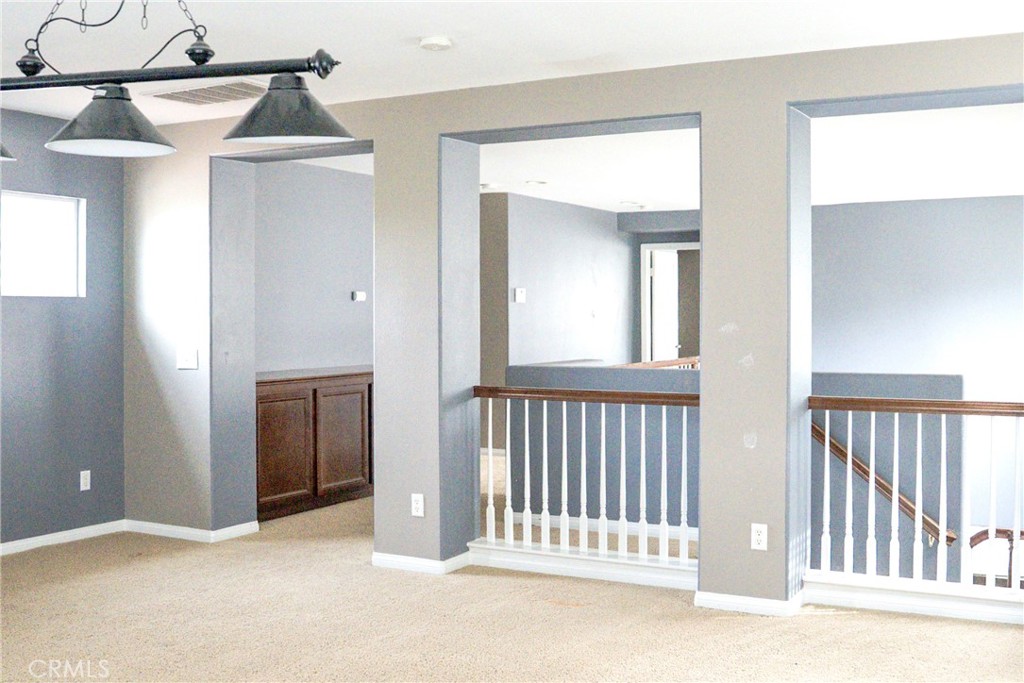 1373 Aztec Court Beaumont, CA 92223 - Photo 22 of 56 a view of a hallway with entryway and dining room