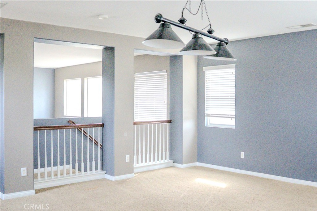 1373 Aztec Court Beaumont, CA 92223 - Photo 24 of 56 a view of an empty room with a window