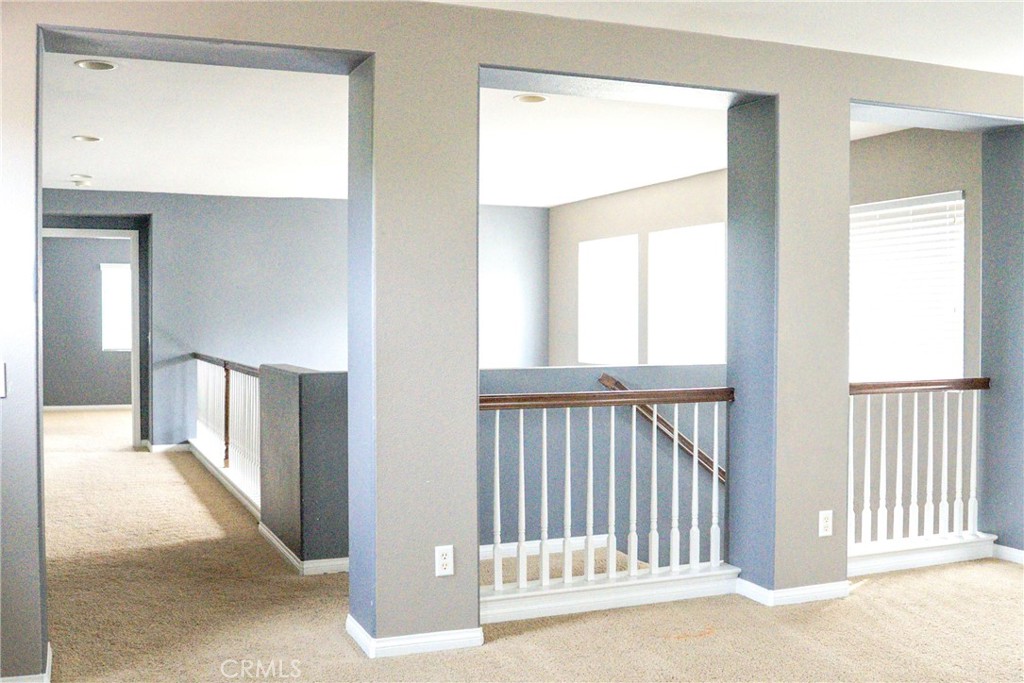 1373 Aztec Court Beaumont, CA 92223 - Photo 26 of 56 a view of a hallway with a porch