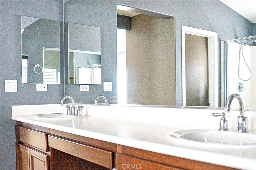 1373 Aztec Court Beaumont, CA 92223 - Photo 33 of 56 a bathroom with a sink and a mirror