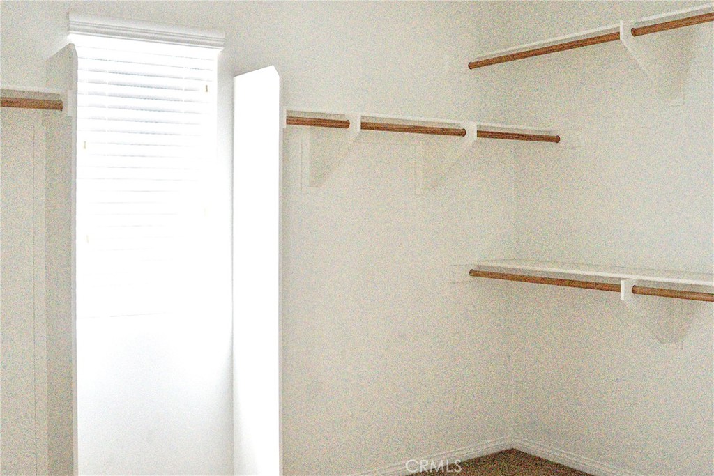 1373 Aztec Court Beaumont, CA 92223 - Photo 36 of 56 a view of a room with racks on the wall