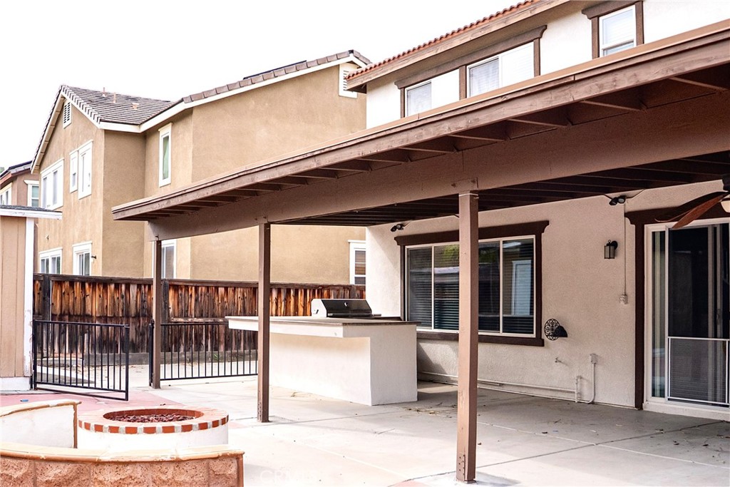 1373 Aztec Court Beaumont, CA 92223 - Photo 50 of 56 a view of a building with a outdoor seating