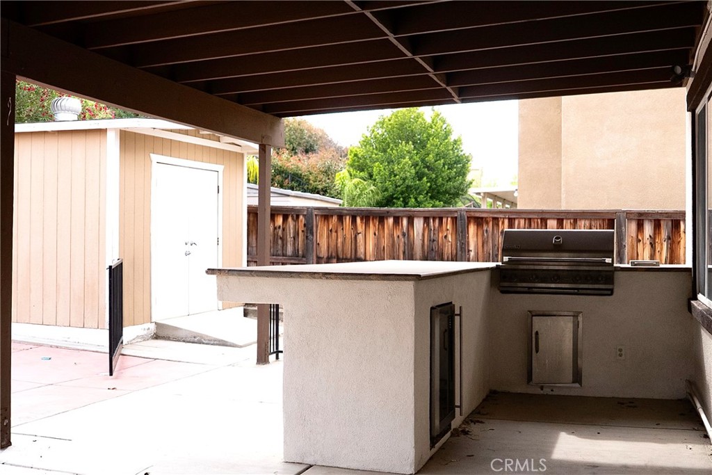 1373 Aztec Court Beaumont, CA 92223 - Photo 51 of 56 a view of roof deck with chair and wooden floor