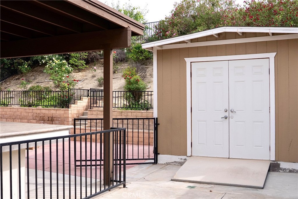 1373 Aztec Court Beaumont, CA 92223 - Photo 53 of 56 a view of a house with porch and wooden floor