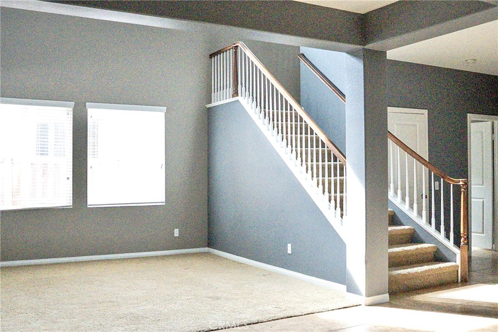 1373 Aztec Court Beaumont, CA 92223 - Photo 7 of 56 a view of an empty room with staircase