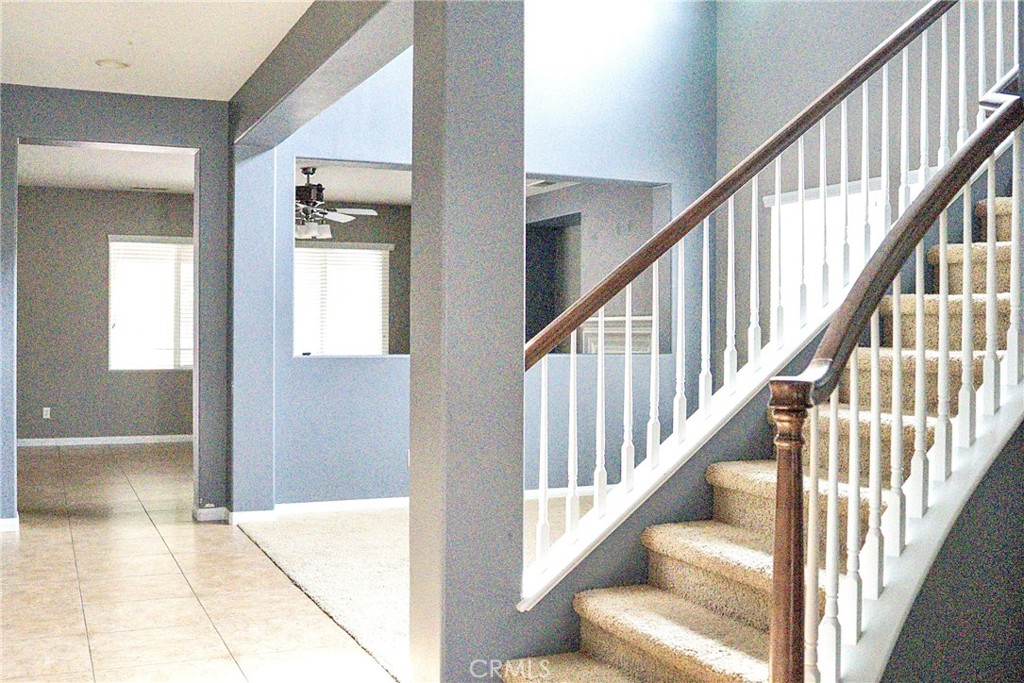 1373 Aztec Court Beaumont, CA 92223 - Photo 8 of 56 a view of an entryway with wooden floor leading to a living room