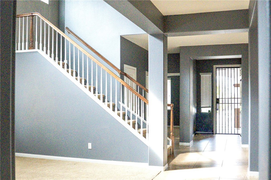 1373 Aztec Court Beaumont, CA 92223 - Photo 10 of 56 a view interior of a house with wooden floor and windows