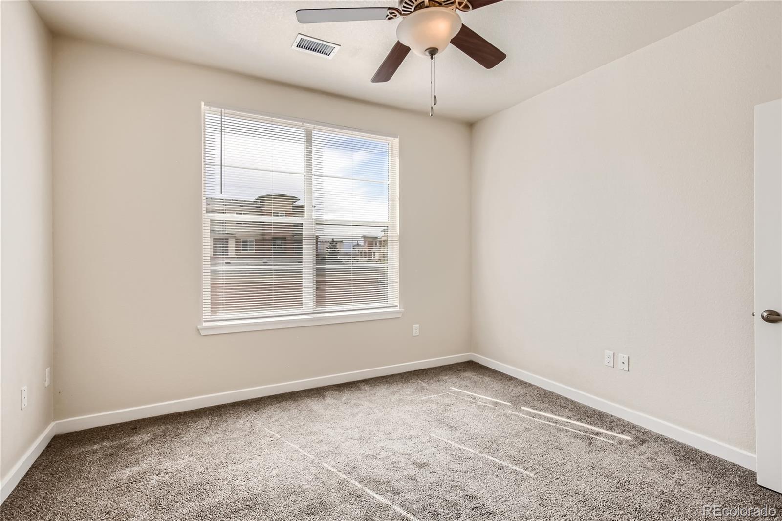 4100 Albion Street, Unit 514 Denver, CO 80216 - Photo 15 of 31 an empty room with a window