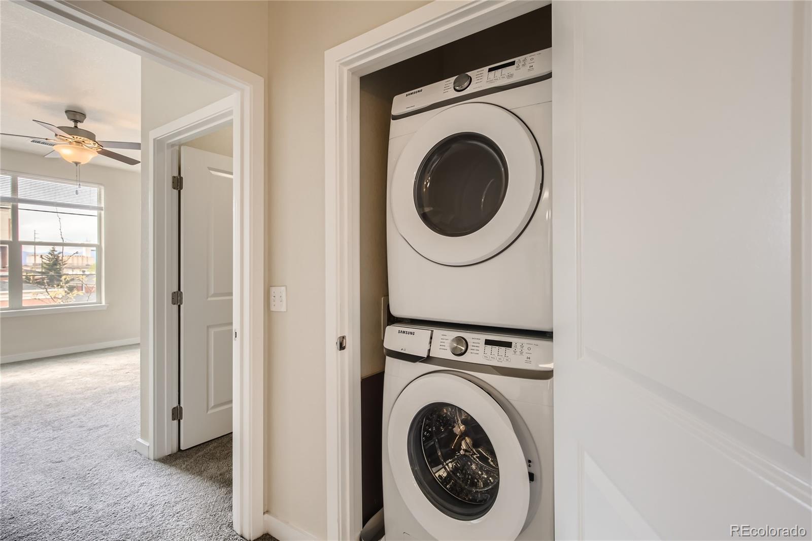 4100 Albion Street, Unit 514 Denver, CO 80216 - Photo 20 of 31 a view of a hallway with washer and dryer