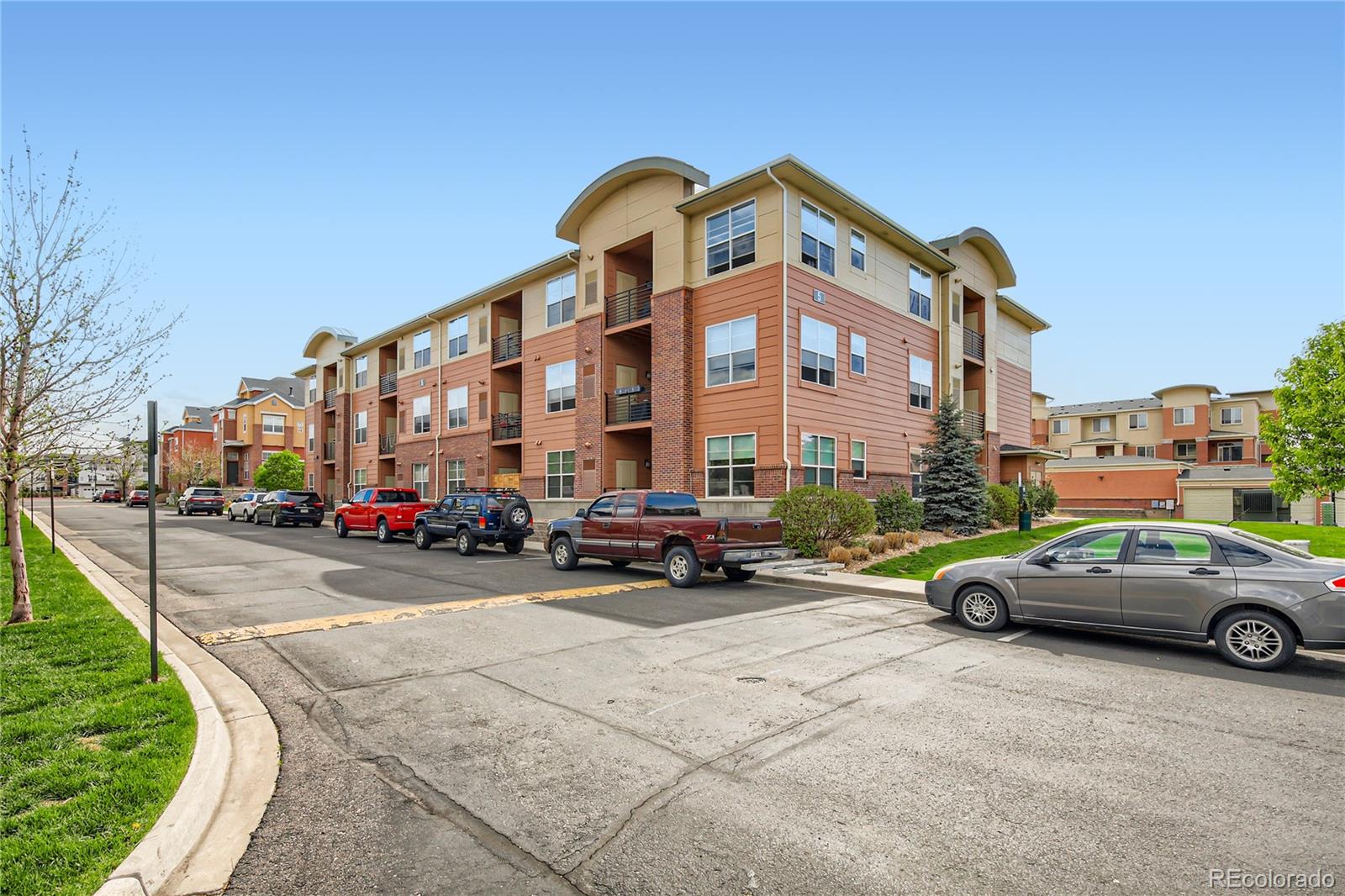 4100 Albion Street, Unit 514 Denver, CO 80216 - Photo 23 of 31 a car parked in front of a building