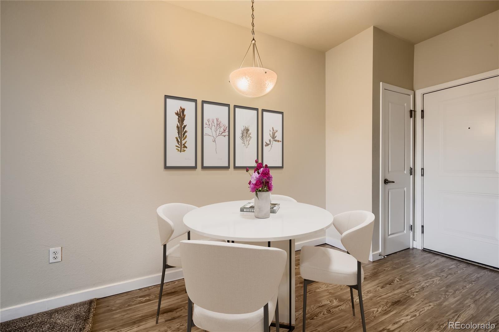 4100 Albion Street, Unit 514 Denver, CO 80216 - Photo 3 of 31 a dining room with furniture and window