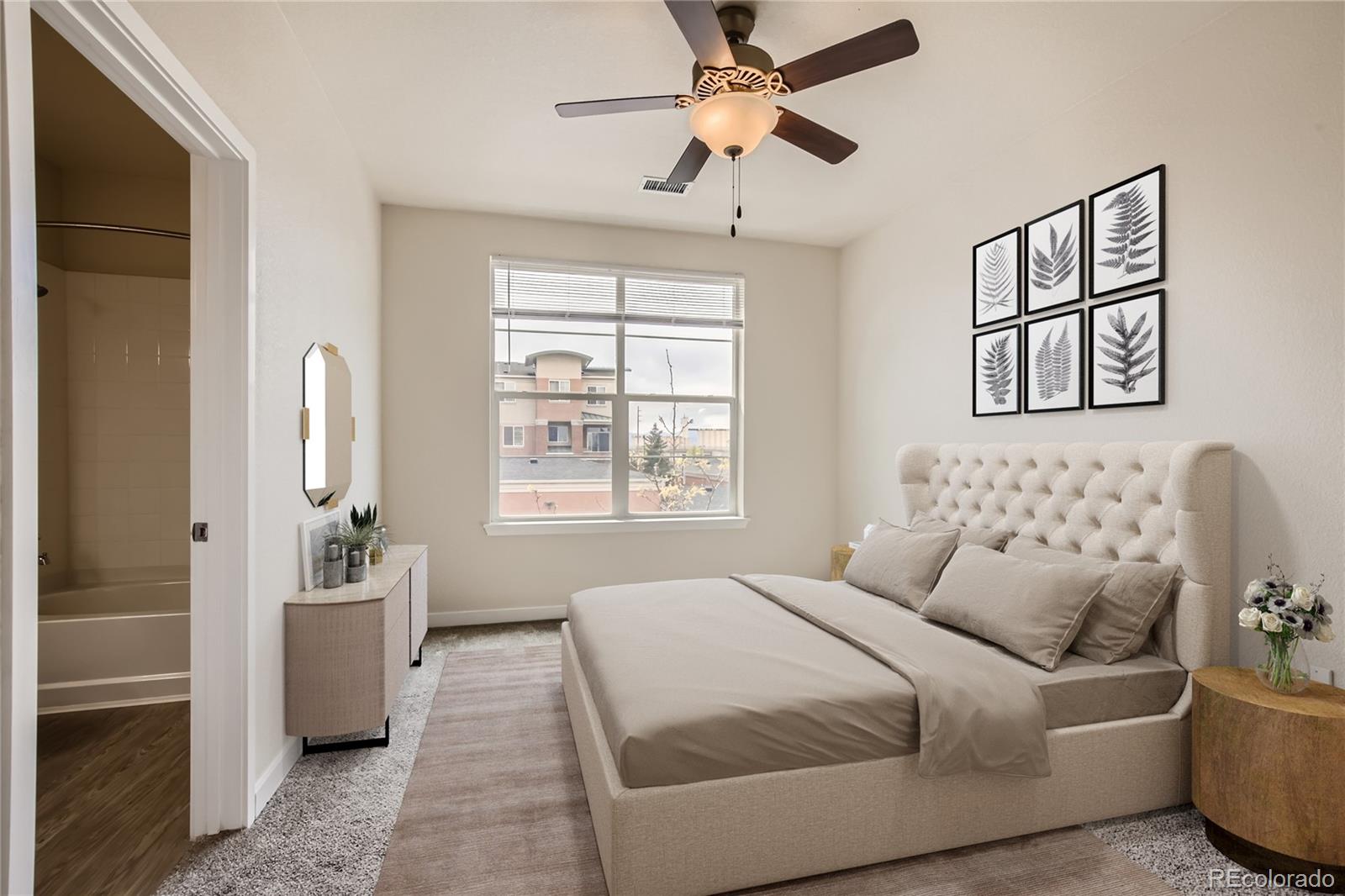4100 Albion Street, Unit 514 Denver, CO 80216 - Photo 4 of 31 a bedroom with a large bed couch and window
