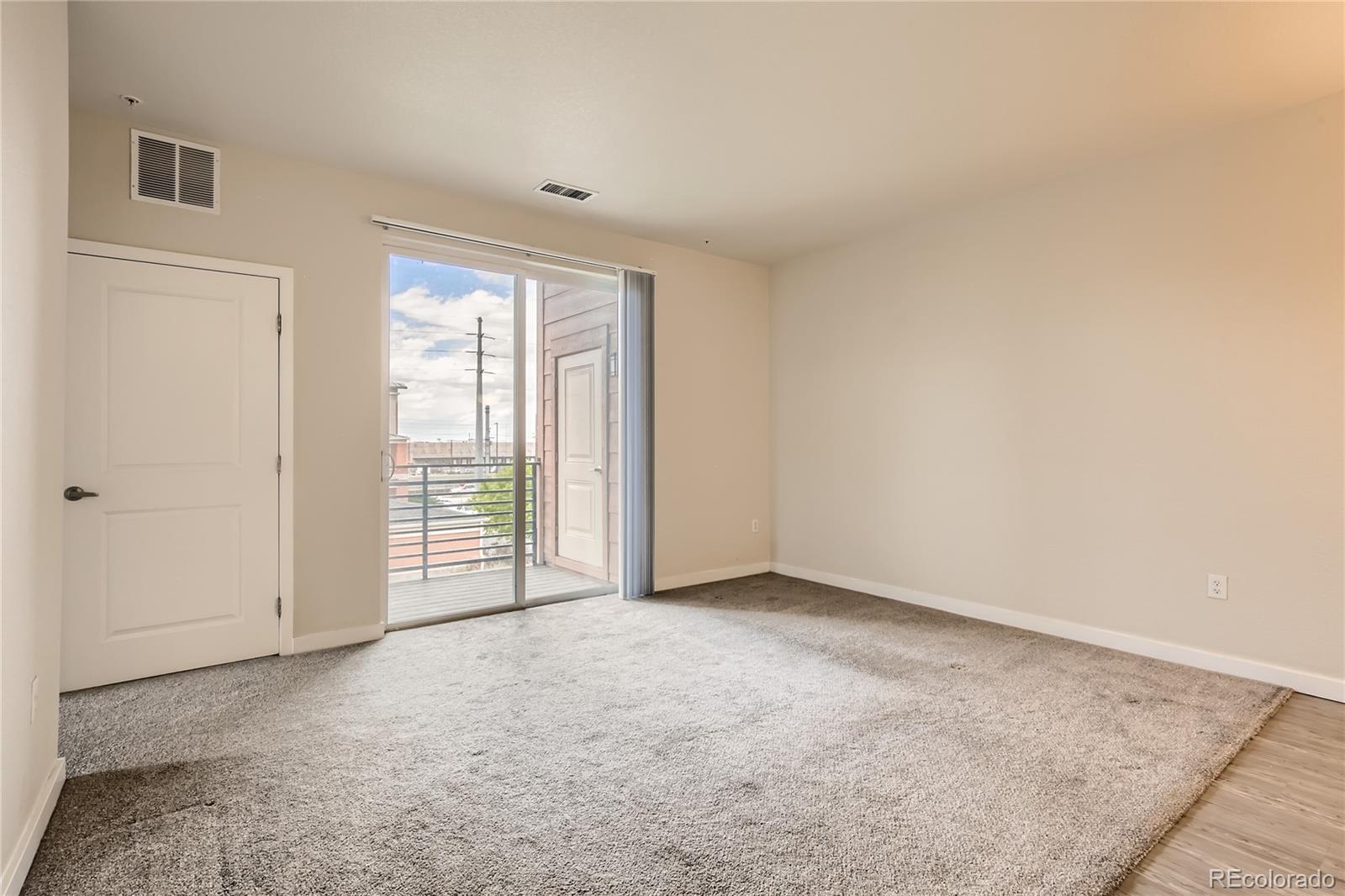 4100 Albion Street, Unit 514 Denver, CO 80216 - Photo 5 of 31 an empty room with windows