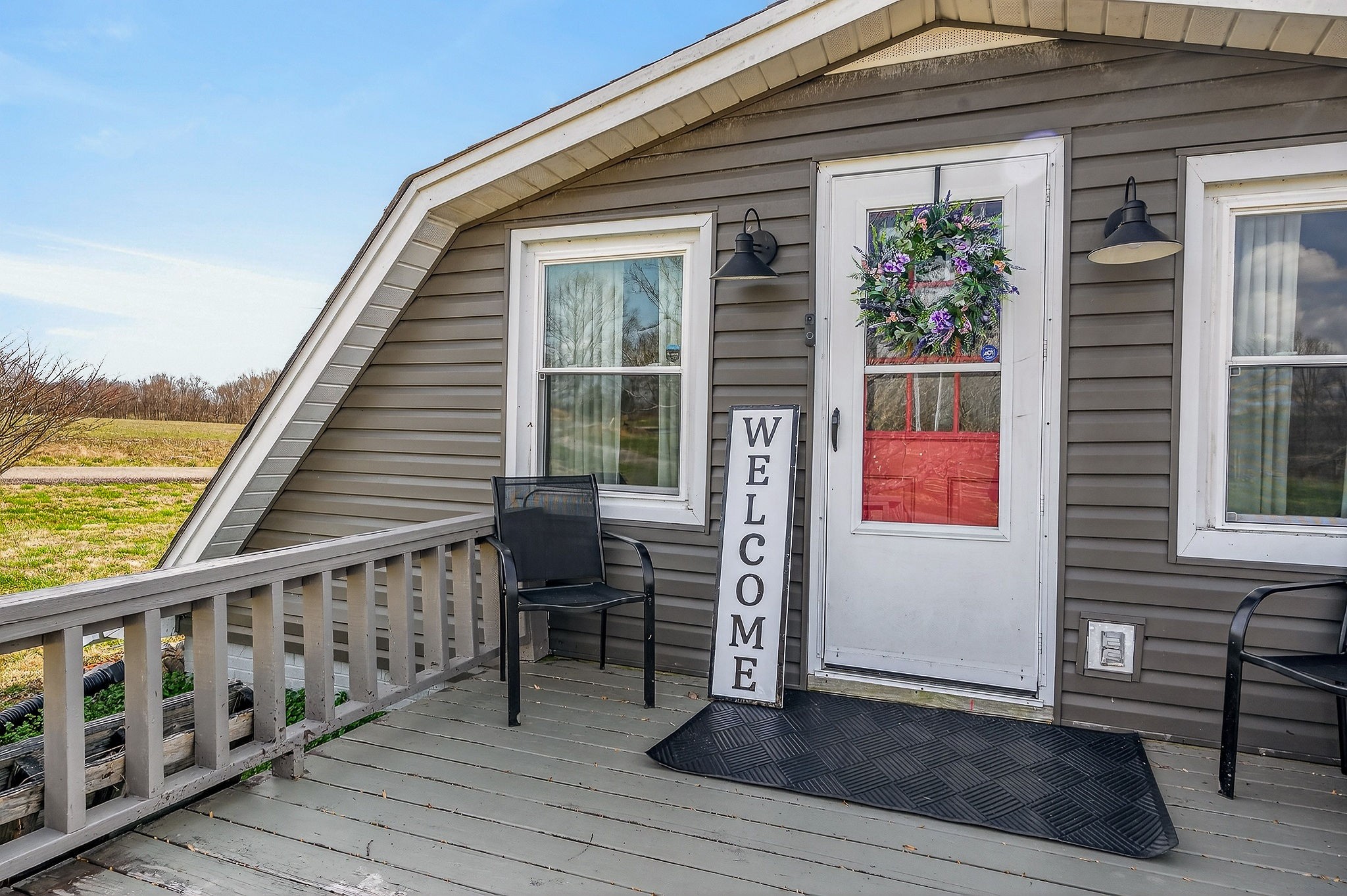 1603 Coon Hunt Road Baxter, TN 38544 - Photo 2 of 51 a balcony with wooden floor and furniture