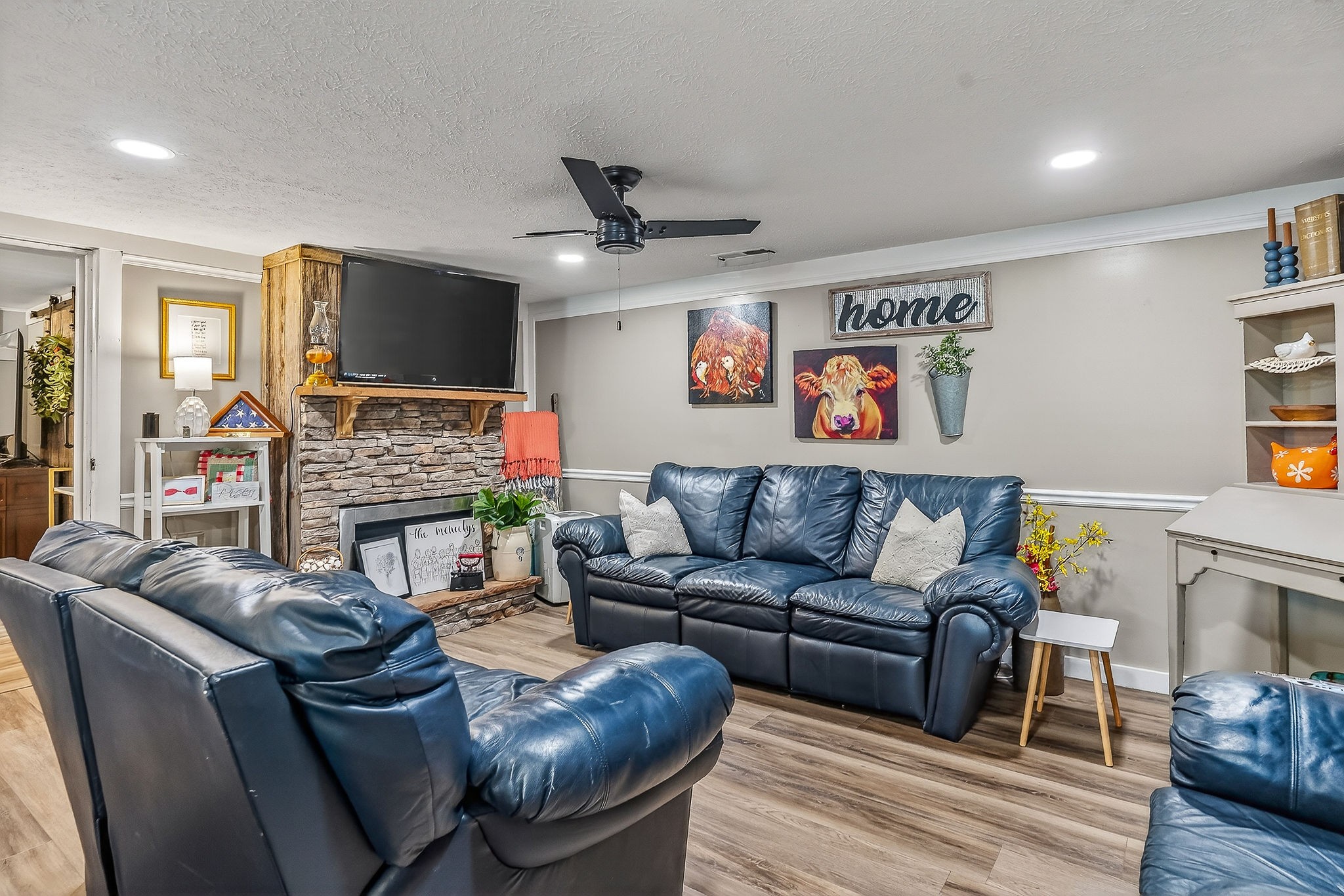 1603 Coon Hunt Road Baxter, TN 38544 - Photo 8 of 51 a living room with furniture a flat screen tv and a fireplace