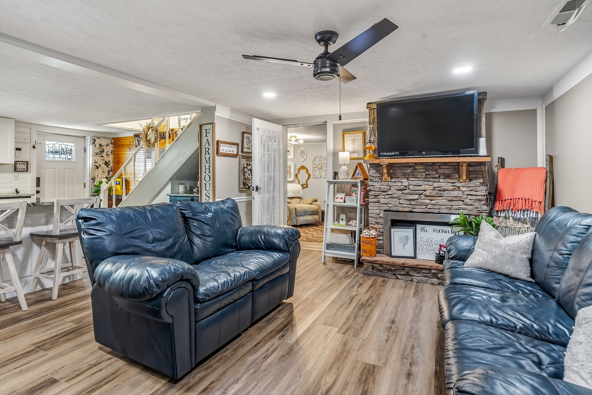 1603 Coon Hunt Road Baxter, TN 38544 - Photo 10 of 51 a living room with furniture a flat screen tv and a fireplace