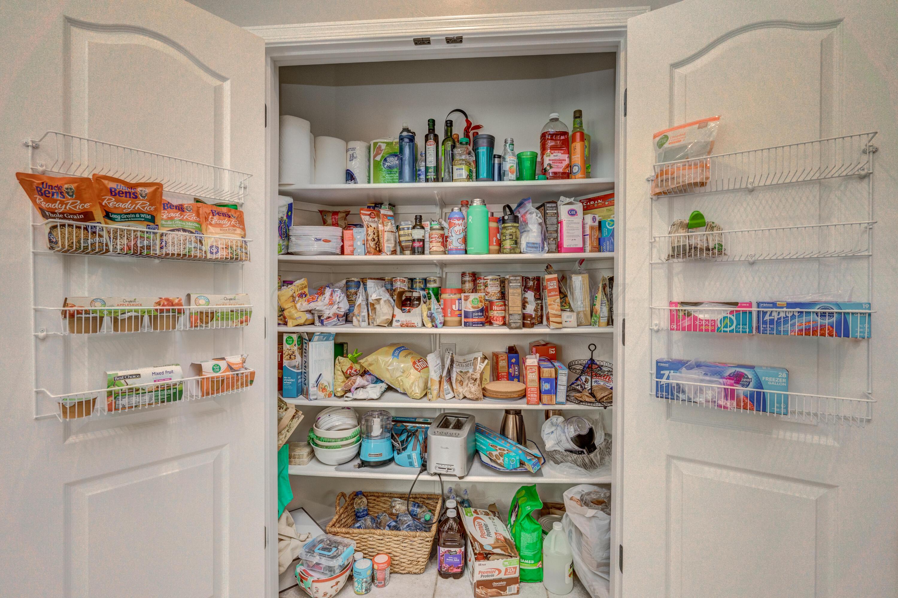 3639 East Northern Dancer Road Tucson, AZ 85739 - Photo 22 of 48 a room with a lots of different kinds of food