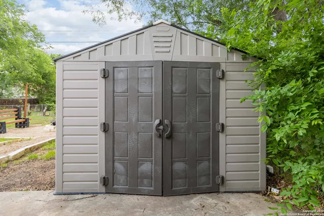 a view of a swimming pool and lounge chairs