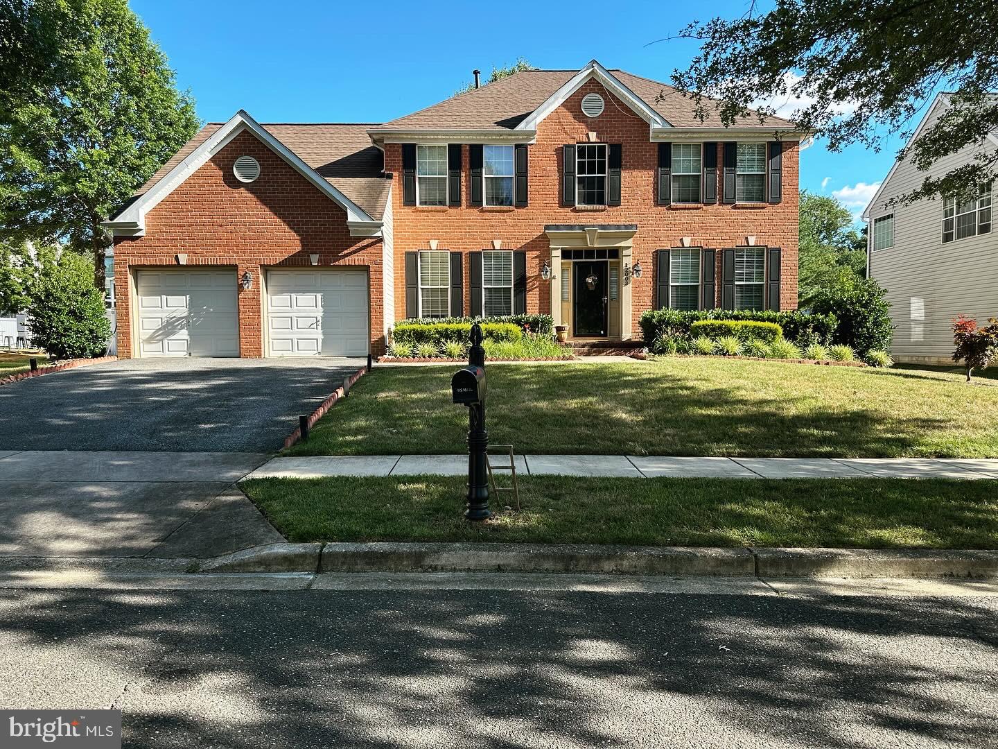 12003 Manchester Way Bowie, MD 20720 - Photo 1 of 49 a front view of a house with a yard