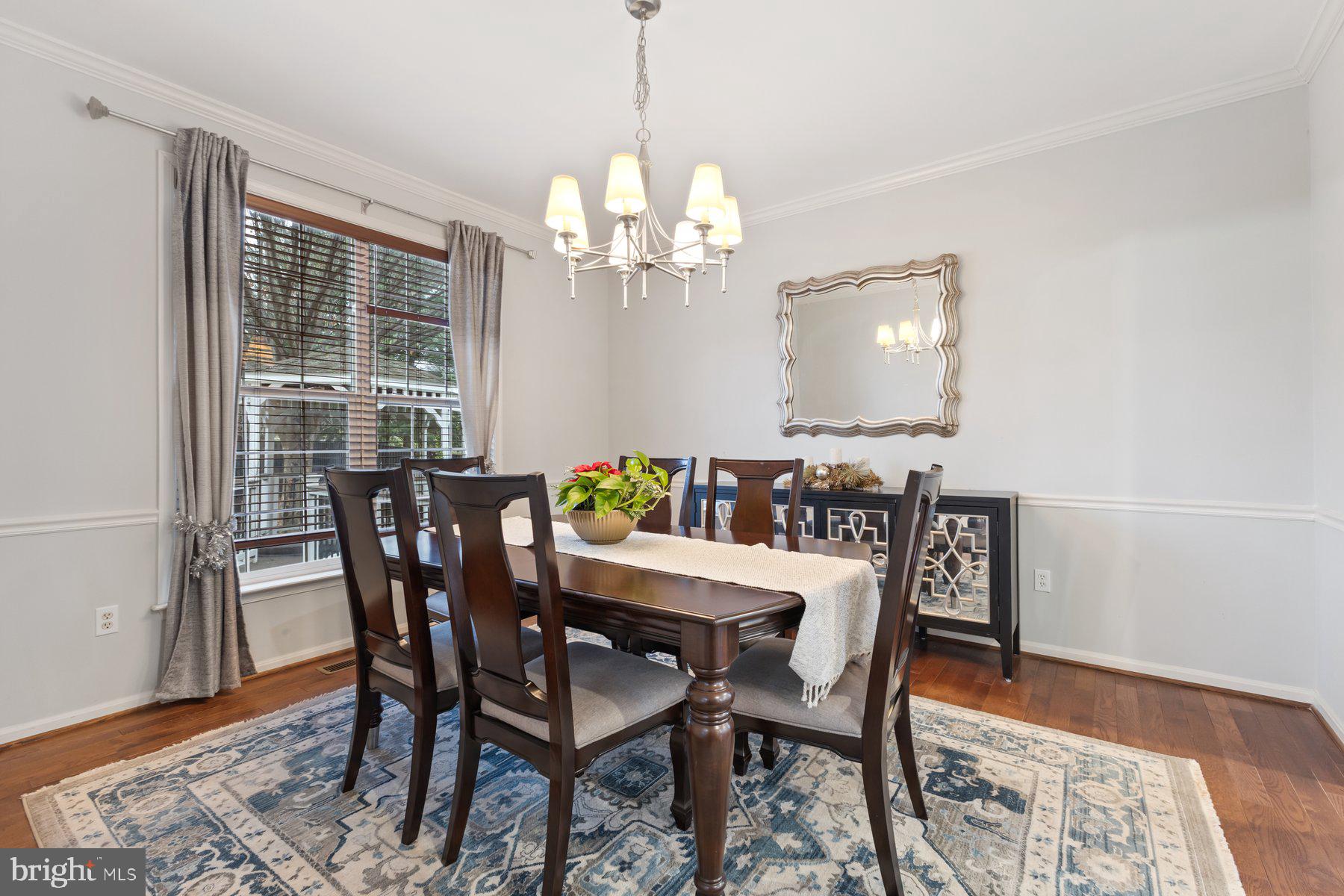 12003 Manchester Way Bowie, MD 20720 - Photo 13 of 49 a view of a dining room with furniture and wooden floor