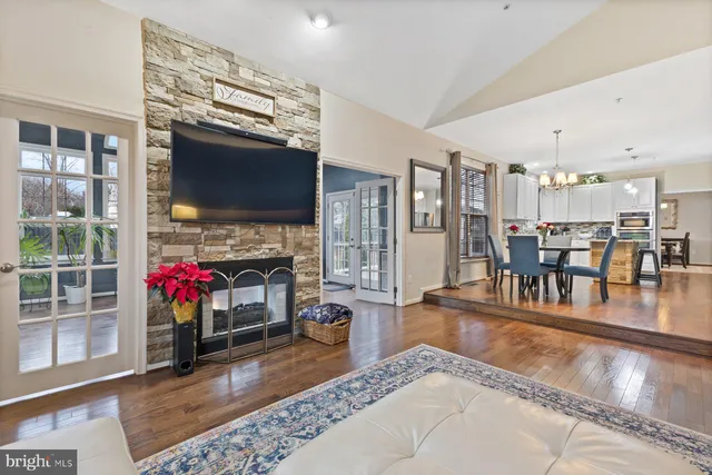 a living room with fireplace furniture and a flat screen tv
