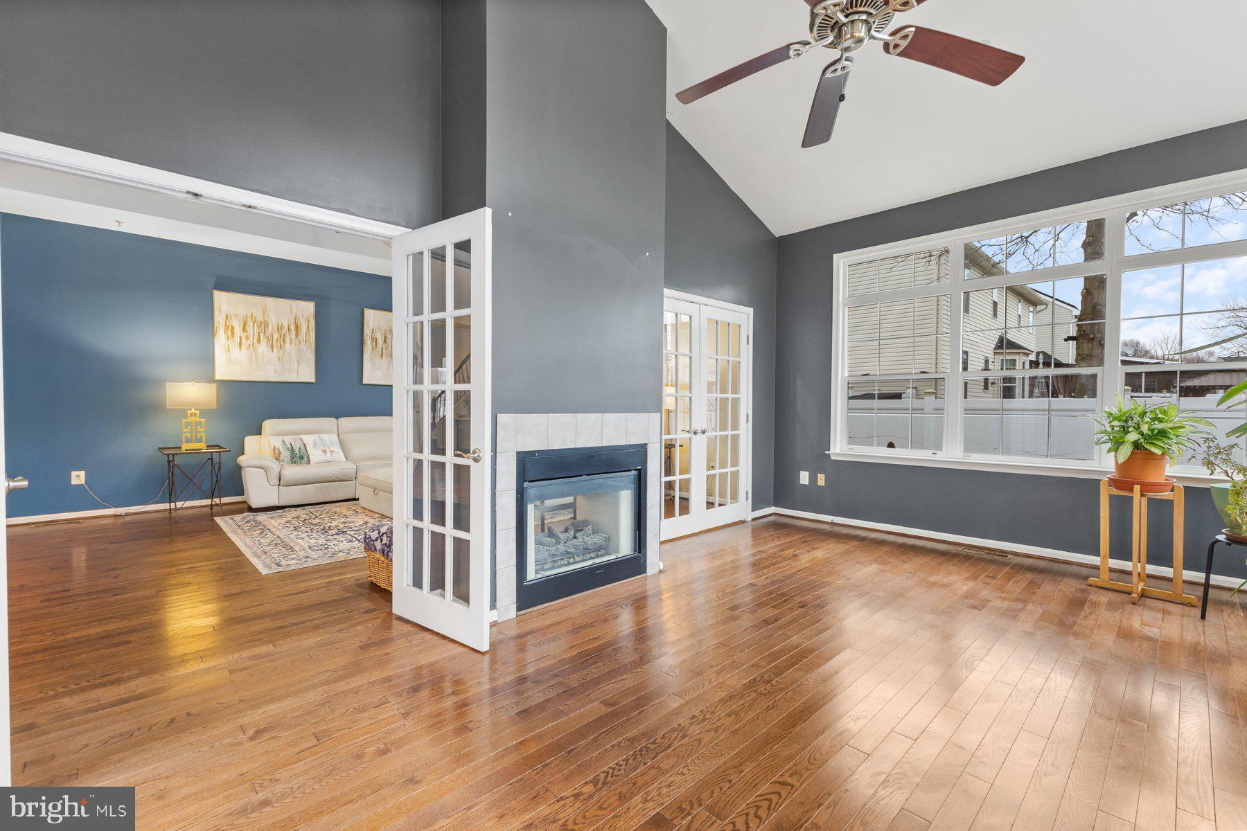12003 Manchester Way Bowie, MD 20720 - Photo 24 of 49 a view of a livingroom with furniture hardwood floor and a ceiling fan