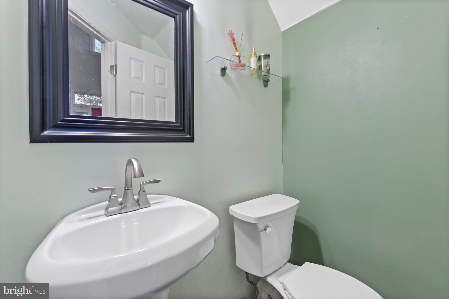 12003 Manchester Way Bowie, MD 20720 - Photo 26 of 49 a bathroom with a toilet a sink and mirror