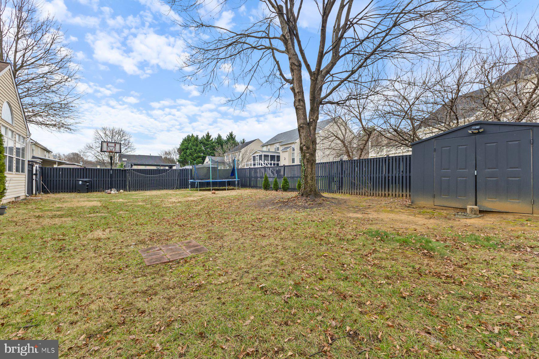 12003 Manchester Way Bowie, MD 20720 - Photo 29 of 49 a swimming pool with outdoor seating and yard