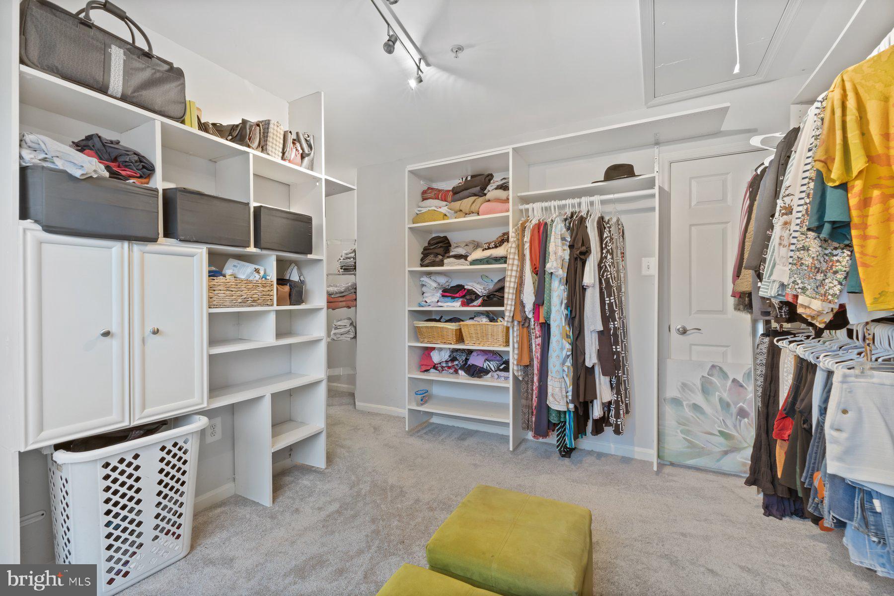 12003 Manchester Way Bowie, MD 20720 - Photo 37 of 49 a view of walk in closet with clothes and shoes