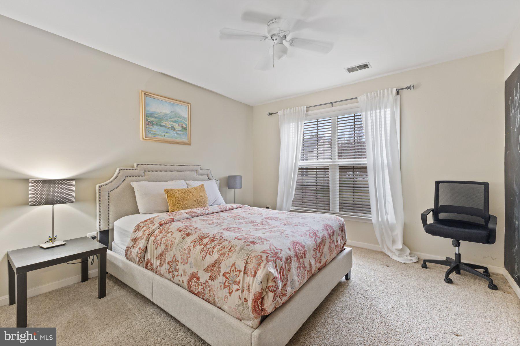 12003 Manchester Way Bowie, MD 20720 - Photo 39 of 49 a bedroom with a bed and a window