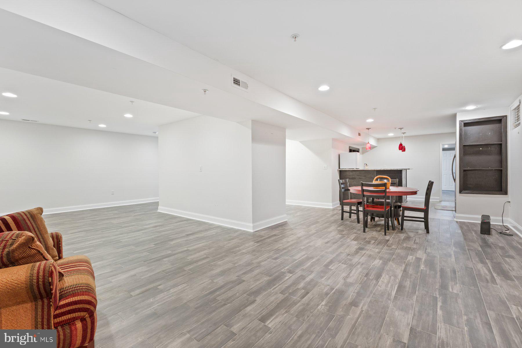 12003 Manchester Way Bowie, MD 20720 - Photo 44 of 49 a living room with furniture and a wooden floor