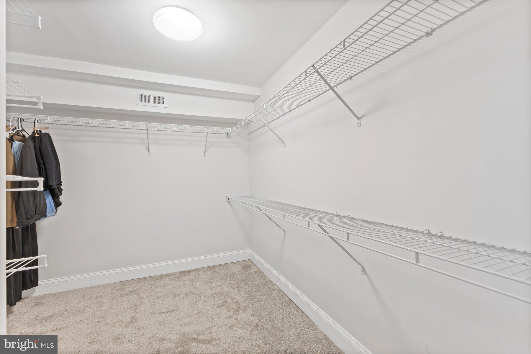 12003 Manchester Way Bowie, MD 20720 - Photo 48 of 49 a view of a room with racks on the wall