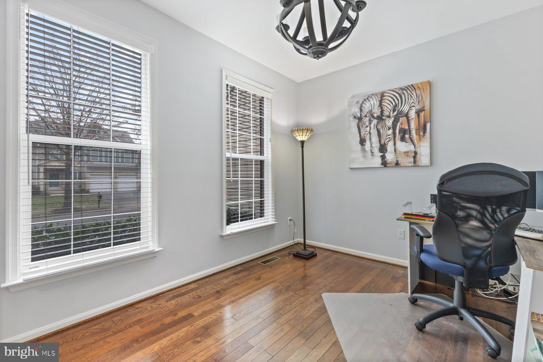 12003 Manchester Way Bowie, MD 20720 - Photo 7 of 49 a view of a workspace with furniture and a window