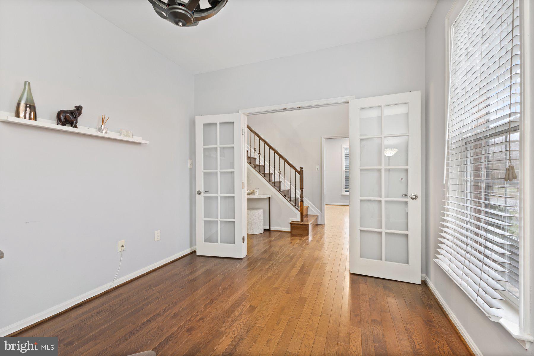 12003 Manchester Way Bowie, MD 20720 - Photo 8 of 49 a view of a hallway with wooden floor and entryway
