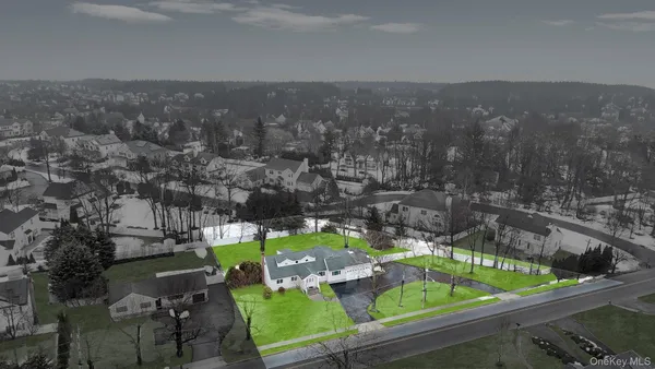 a view of a chairs and table in patio