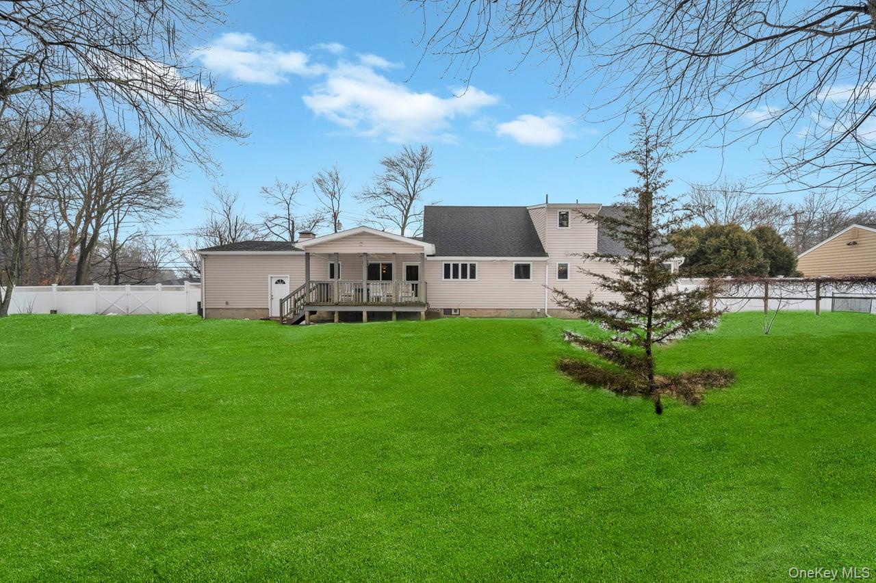 105 Browns Road Nesconset, NY 11767 - Photo 12 of 50 a view of a house with a yard