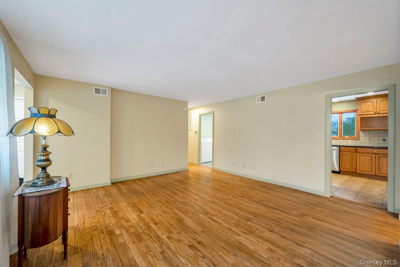 105 Browns Road Nesconset, NY 11767 - Photo 17 of 50 a view of a livingroom with wooden floor