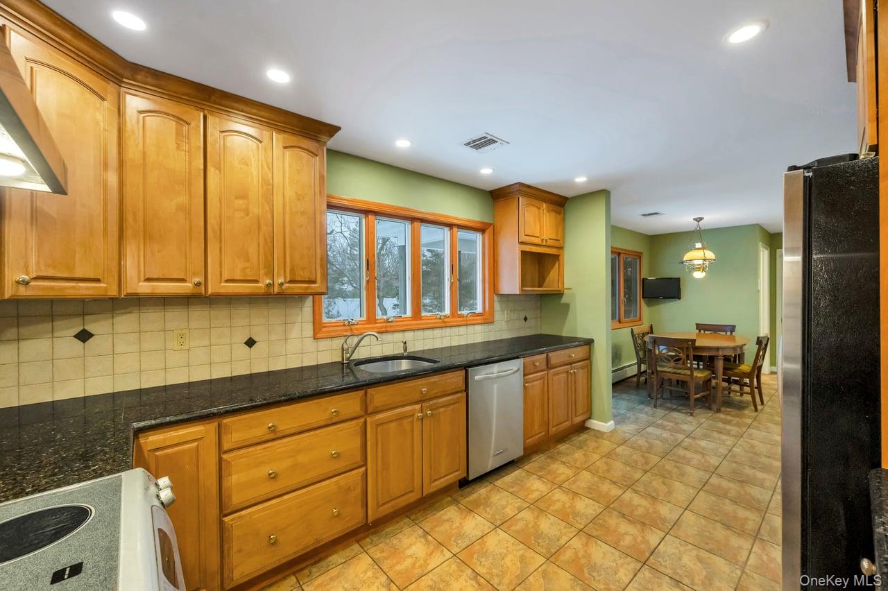 105 Browns Road Nesconset, NY 11767 - Photo 24 of 50 a large bathroom with a large window and double vanity