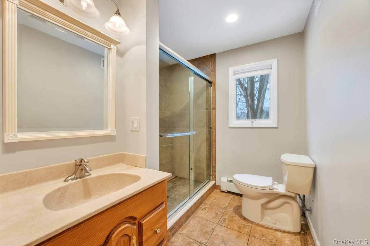 105 Browns Road Nesconset, NY 11767 - Photo 25 of 50 a bathroom with a sink toilet and shower