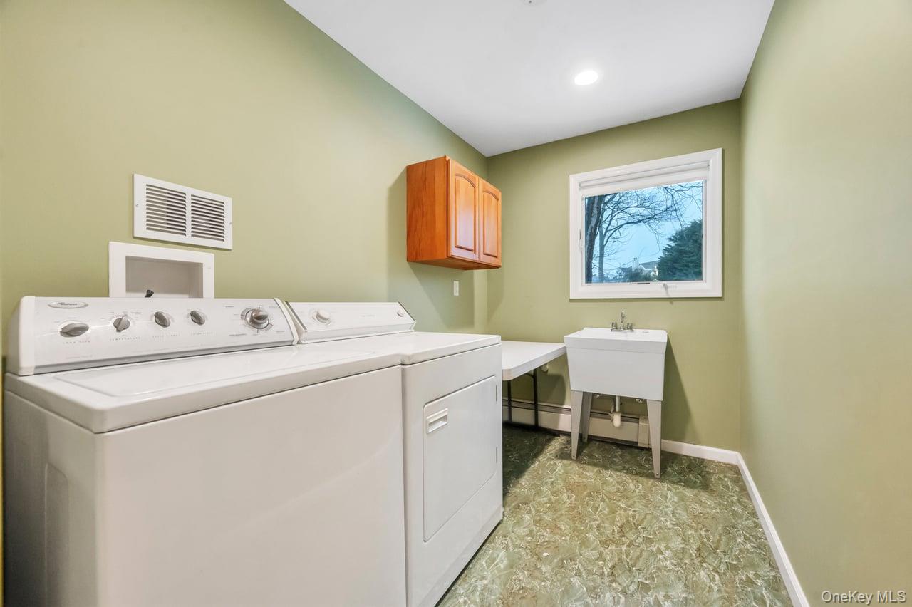 105 Browns Road Nesconset, NY 11767 - Photo 35 of 50 a utility room with dryer and washer