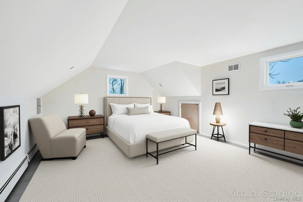 105 Browns Road Nesconset, NY 11767 - Photo 36 of 50 a spacious bedroom with a bed and a couch