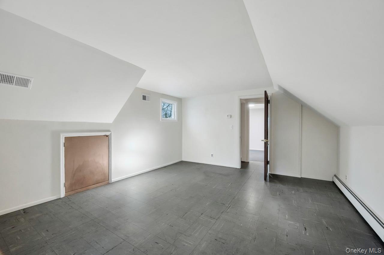 105 Browns Road Nesconset, NY 11767 - Photo 38 of 50 an empty room with a natural light