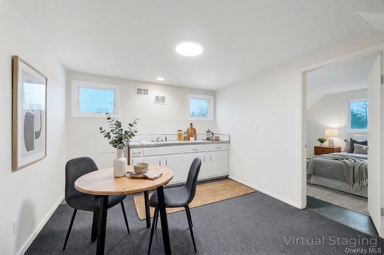 105 Browns Road Nesconset, NY 11767 - Photo 39 of 50 a view of a dining room with furniture and window