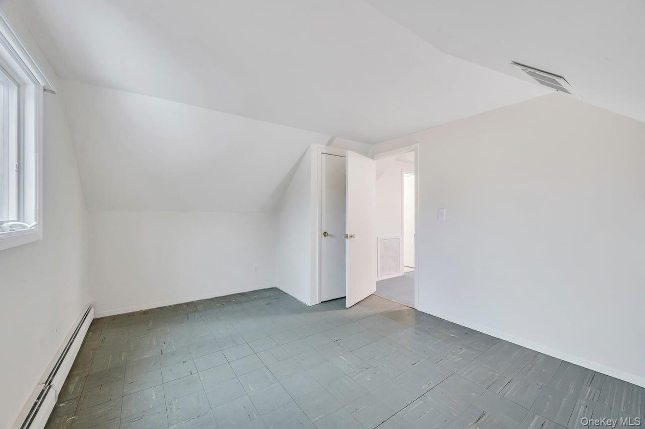 105 Browns Road Nesconset, NY 11767 - Photo 42 of 50 an empty room with a empty space and windows