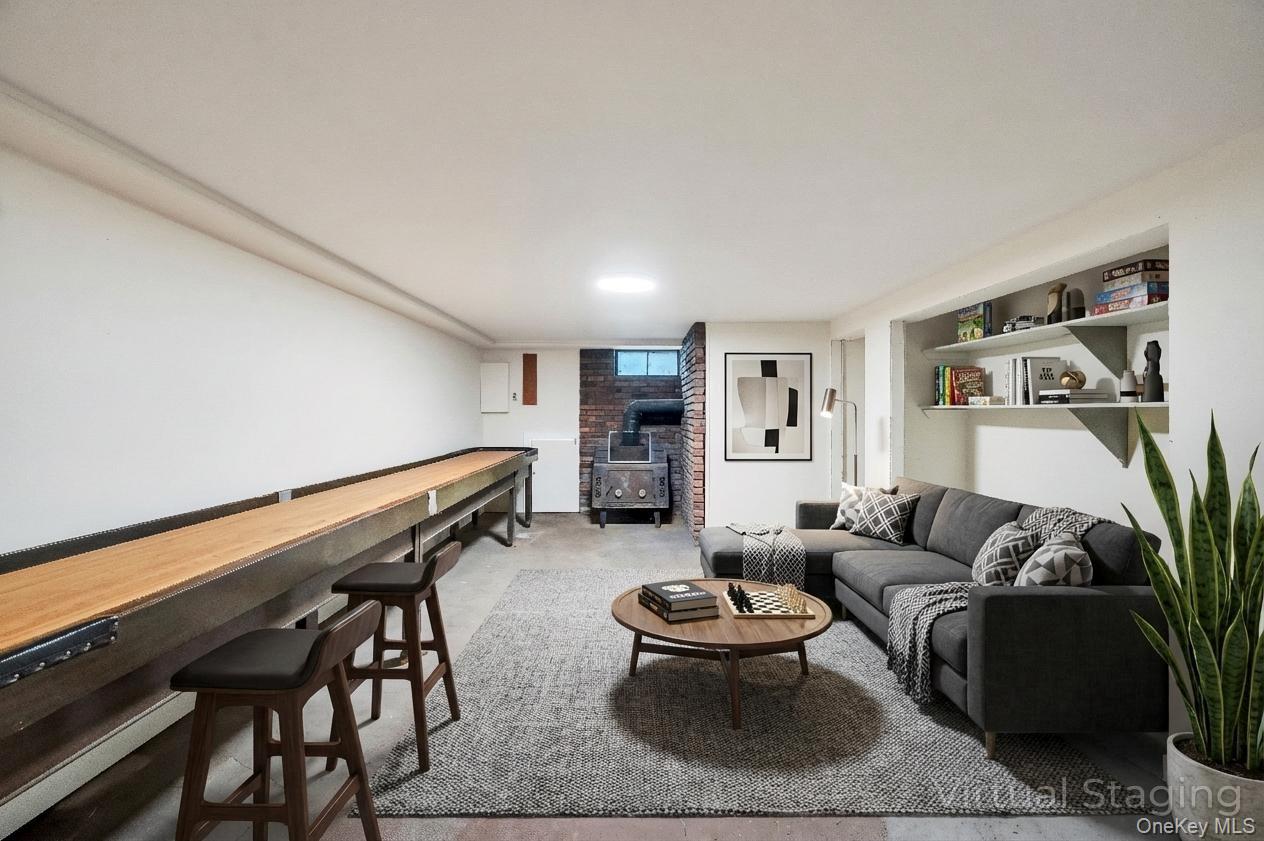 105 Browns Road Nesconset, NY 11767 - Photo 45 of 50 a living room with furniture and wooden floor