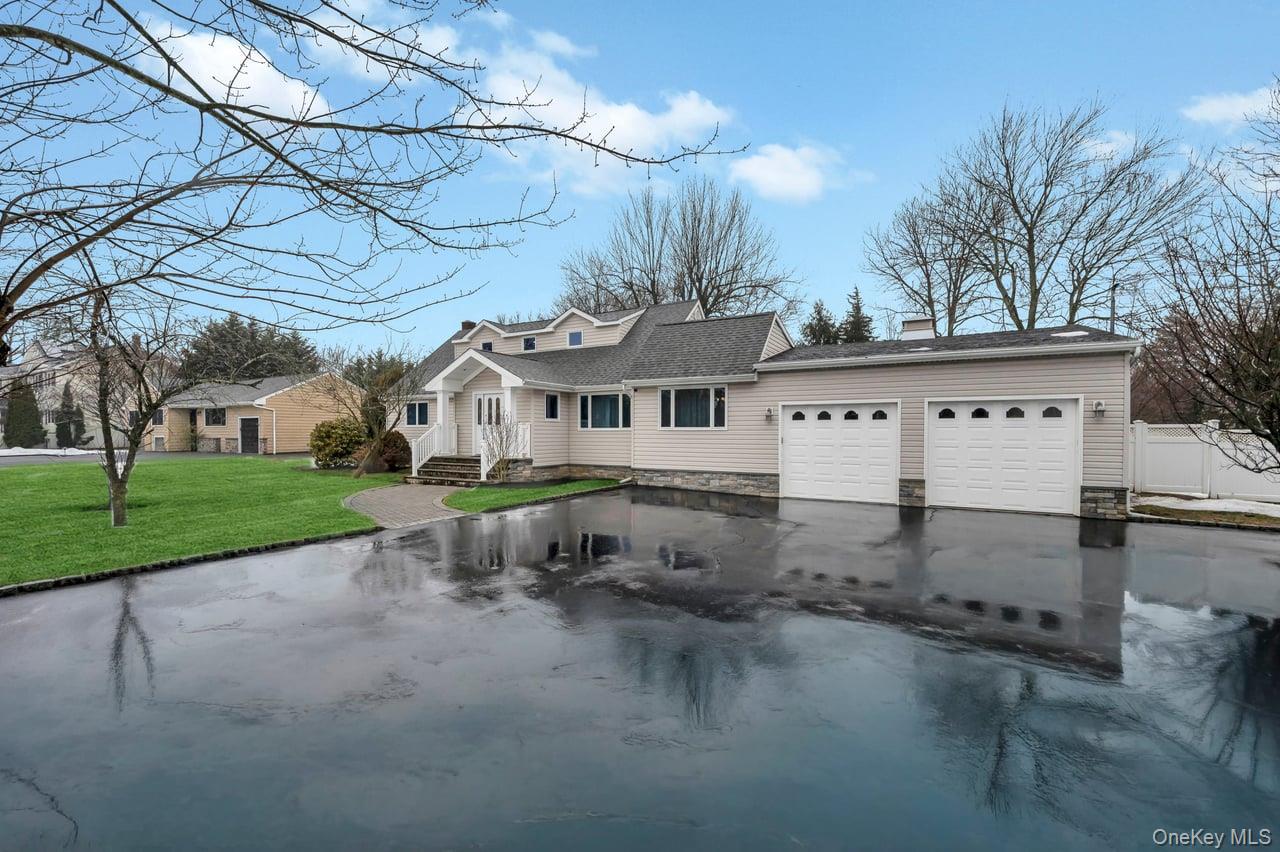 105 Browns Road Nesconset, NY 11767 - Photo 5 of 50 front view of a house with a yard