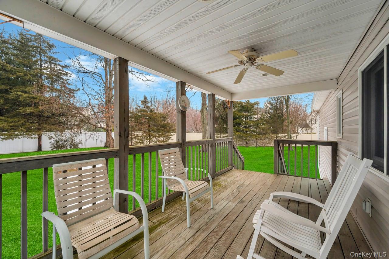 105 Browns Road Nesconset, NY 11767 - Photo 9 of 50 a view of deck with furniture and a backyard