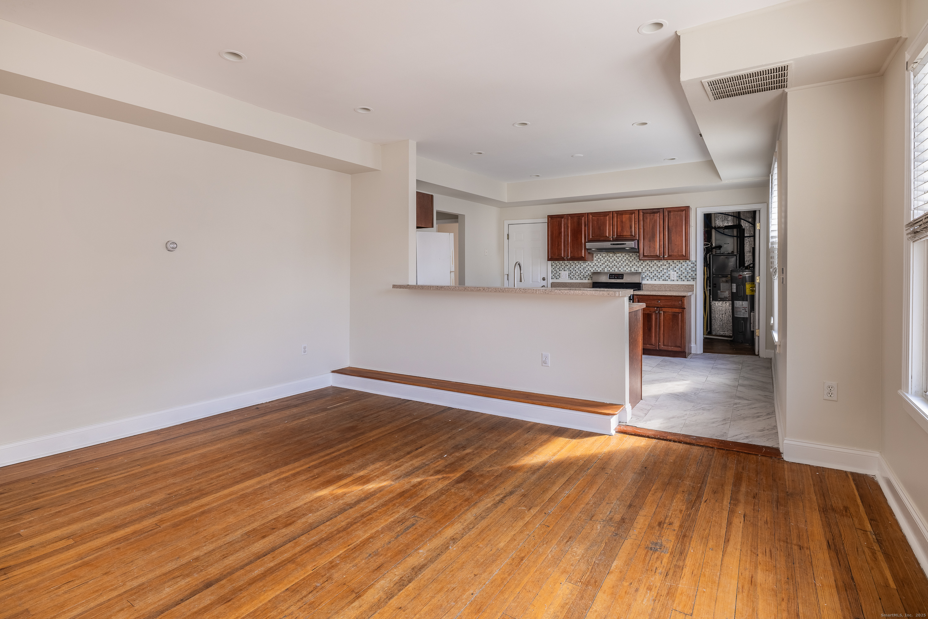 25 Hunting Street Bridgeport, CT 06606 - Photo 13 of 26 a view of kitchen and wooden floor