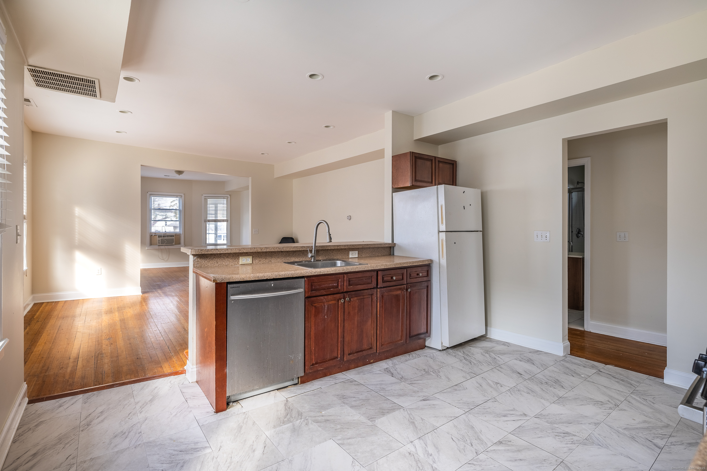 25 Hunting Street Bridgeport, CT 06606 - Photo 15 of 26 a kitchen with stainless steel appliances granite countertop a refrigerator and a sink